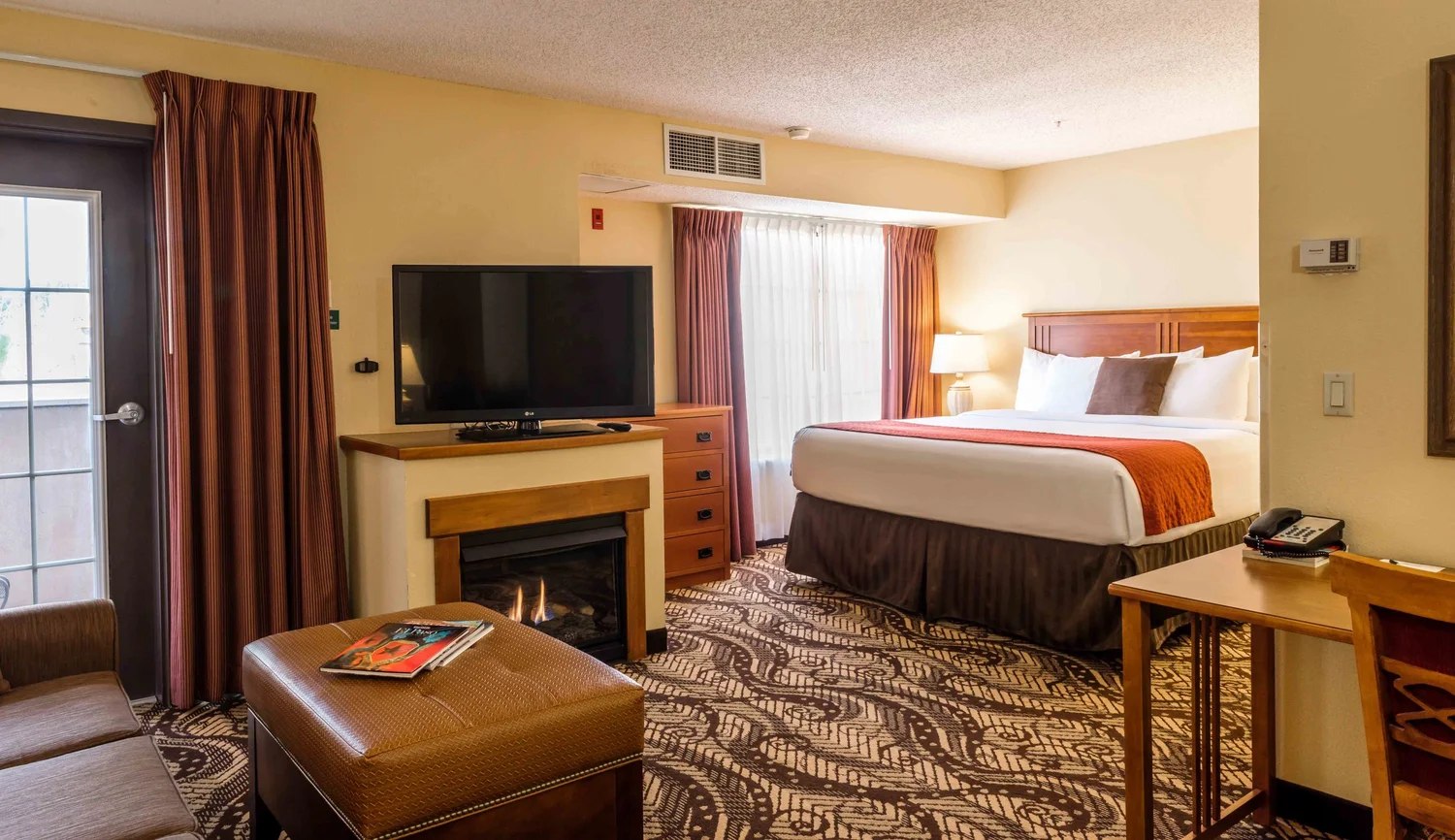 A king studio suite at MCM Eleganté Lodge & Resort.